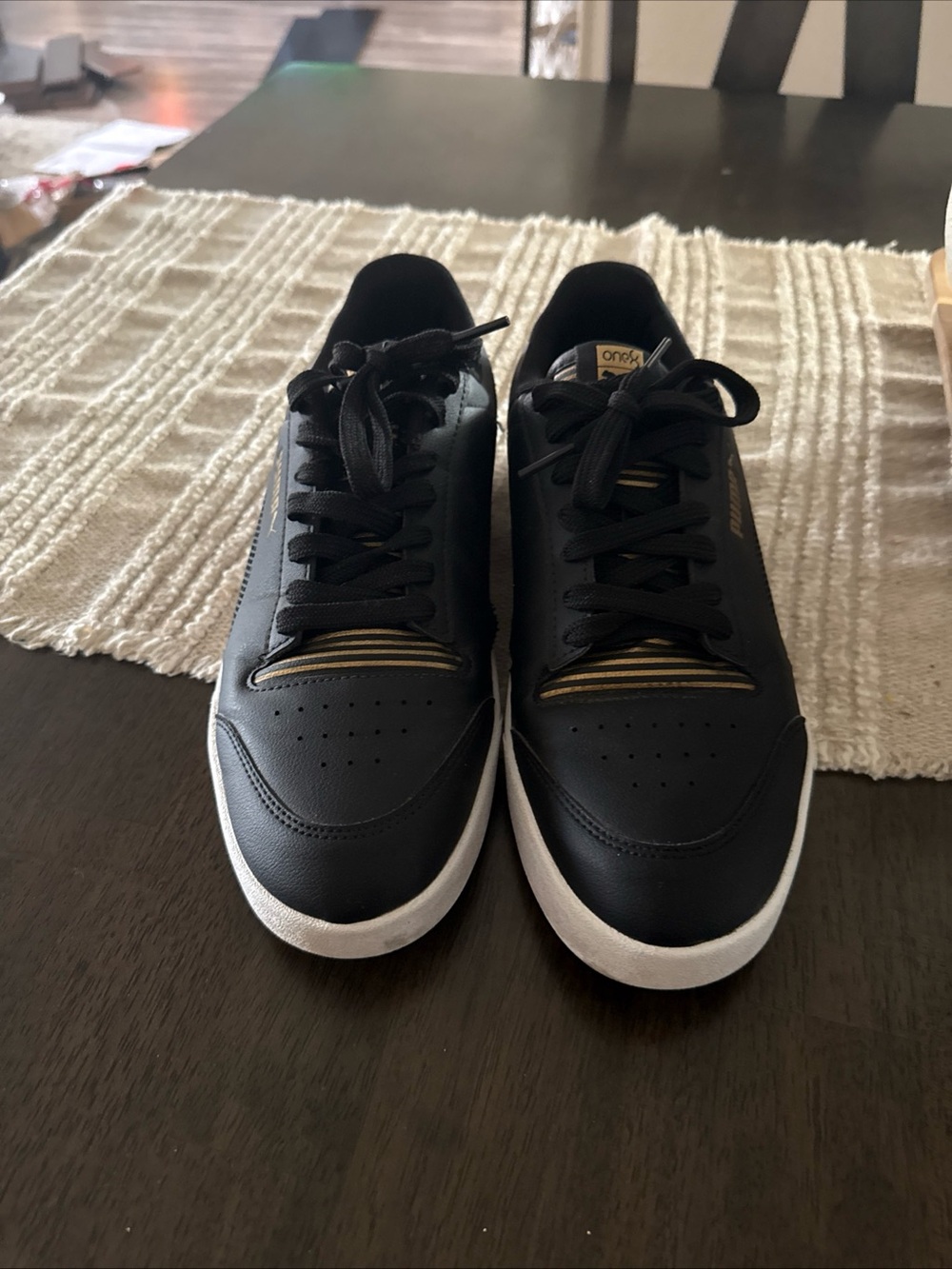 Puma Black and Gold Low-Top Sneakers